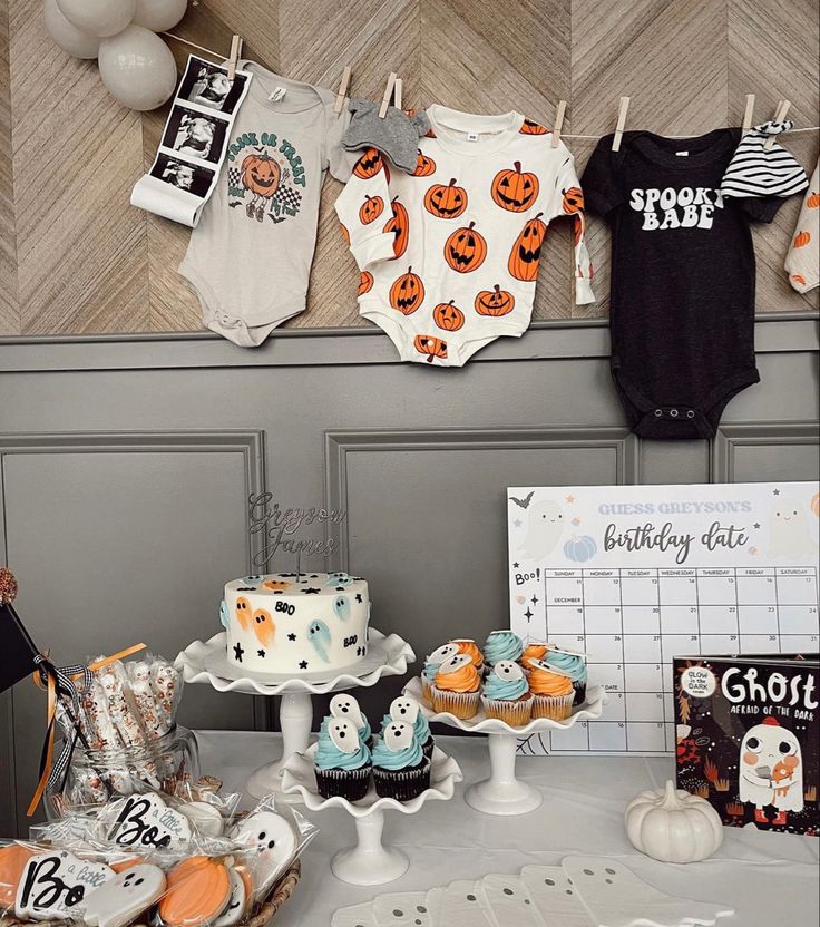 a baby's first birthday party with cupcakes, cake and other decorations