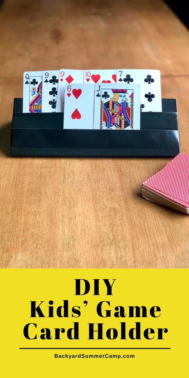 the diy kids'game card holder has four cards in it and is sitting on a table