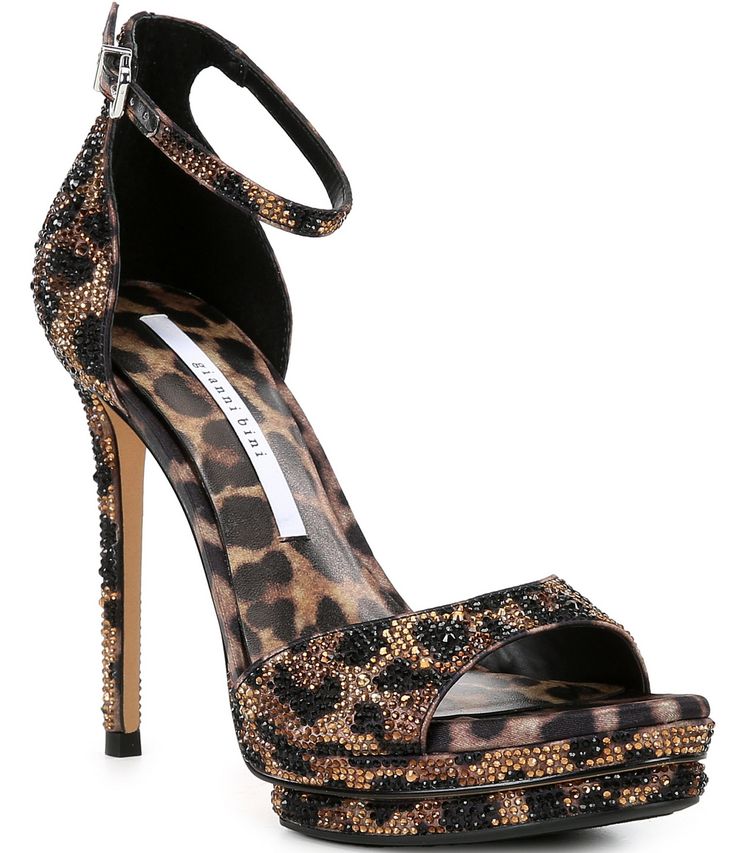 From Gianni Bini, the NessieTwo Leopard Print Rhinestone Platform Dress Sandals feature:Leopard printed fabric upper with rhinestone embellishmentsAnkle strap with buckle closureSynthetic lining4mm padded memory foam sockRubber outsoleApprox. 0.59" platform heightApprox. 4.72" heel heightImported. How To Style Platform Heels, Cool Heels, Leopard Print Party, Y2k Heels, Cute Shoes For Women, Cheetah Heels, Cheetah Print Heels, Leopard Print Fabric, Clothing Shops