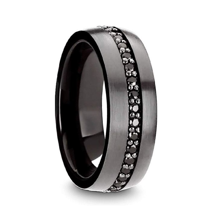 a wedding ring with black and white diamonds on the inside, set in 18k white gold