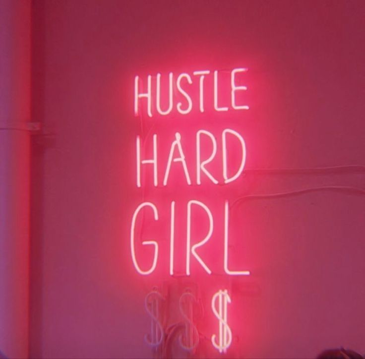 a neon sign that says hustle hard girl