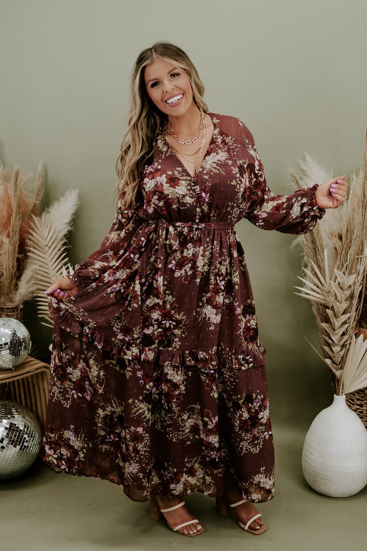 Our Midnight Enchantment Maxi Dress has long whimsical sleeves, stunning multi colored boho designs, lined skirt, and a flirty floucy hem. Style this piece with your favorite accessories and you are going to make an everlasting impression! Neckline: v- neckline with swoop detail Fabric: 97% polyester, 3% Lurex Details: Floucy hem, lined skirt, tiered skirt, boho floral pattern, and long whimsical sleeves 100% Polyester Fit: Oversized; maxi fit Model Specs: Karli is wearing the small in photos. ( Long Sleeve Boho Dress With Floral Print For Fall, Bohemian Long Sleeve Dresses For Fall, Long Sleeve Brown Bohemian Boho Dress, Brown Long Sleeve Boho Dress, Fall Floral Print Boho Maxi Dress, Bohemian Ruffled Dresses For Fall, Bohemian Ruffle Dresses For Fall, Bohemian Maxi Dress With Ruffle Hem For Party, Long Sleeve Boho Print Dress For Fall