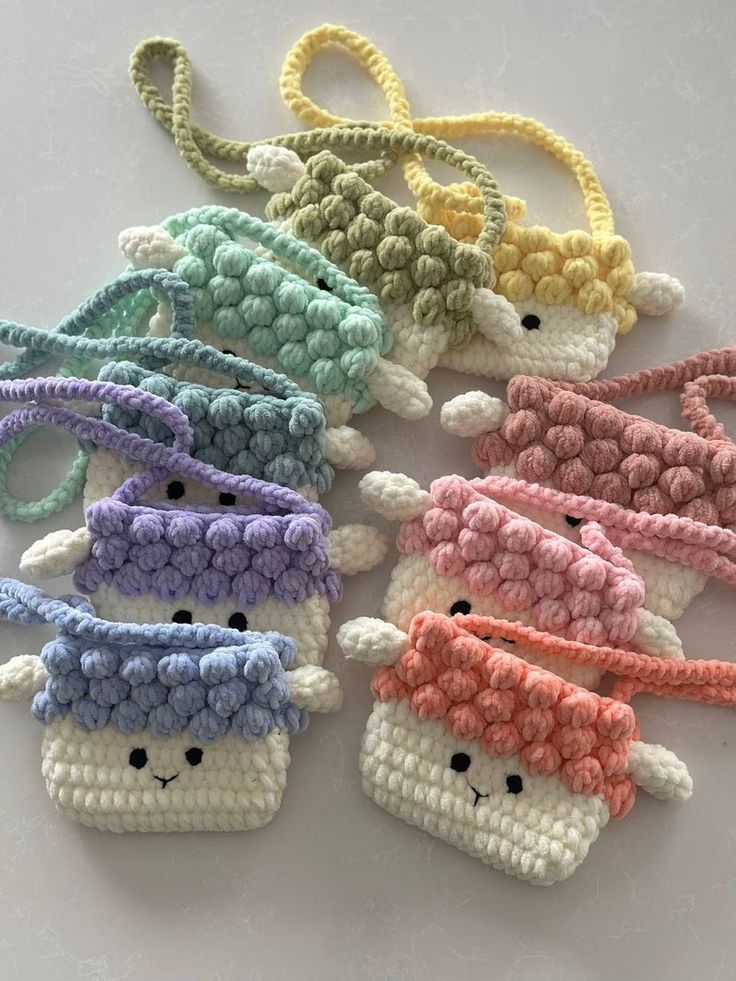 small crocheted sheeps with different colors on them