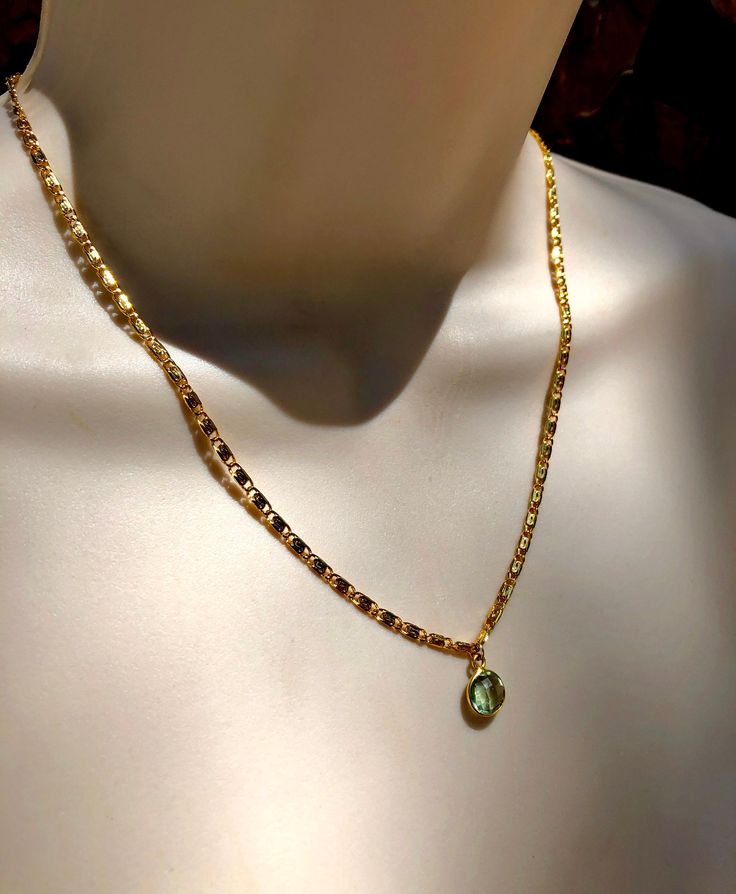 This gorgeous Italian gold scroll chain is made of 24k gold fill and is nickel and lead free. This is Dayna Kathan's third necklace in her Reunion 8 look. The bezel pendant is a light green amethyst stone. DAYNA WEARS THE 17 inches length in Reunion 8. *There are several sizes available. **This necklace does not come with an extension chain. Photos 2,5 and 6 are paired with other necklaces from Dayna's Reunion look. Dainty Gold Emerald Necklace With Delicate Chain, Gold Brass Jewelry With Figaro Chain, Gold Brass Figaro Chain Jewelry, Gold Figaro Chain Jewelry In Brass, Gold Emerald Necklace With Delicate Chain For Gift, Gold Oval Necklace For May Birthstone, Dainty Gold Emerald Necklace Gift, Gold Necklaces With Figaro Chain And Oval Pendant, Gold Emerald Necklace For Jewelry Making, May Birthstone