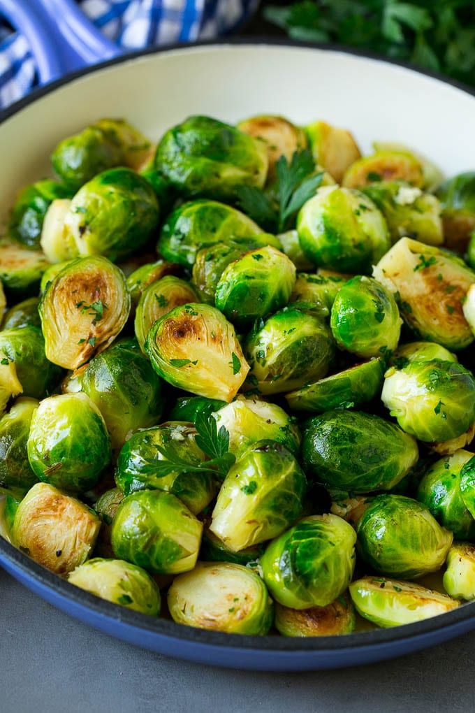 brussel sprouts in a white bowl on a table