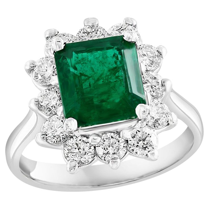 A stunning well-crafted engagement ring showcasing a 3.17-carat certified emerald-cut vivid green emerald. Flanking the center diamond are perfectly matched brilliant cut 12 diamonds weighing 1.20 carat in total, set in a polished 14K White Gold mounting. Handcrafted in our New York City workshop. Green Emerald is approx 9.05 x 8.41 x 5.66 mm. Style is available in different price ranges. Prices are based on your selection. Please contact us for more information. Graduation Nails, Nails White, Emerald Diamond Ring, Square Nails, Green Emerald, Emerald Diamond, Jewelry Rings Engagement, White Nails, Emerald Cut