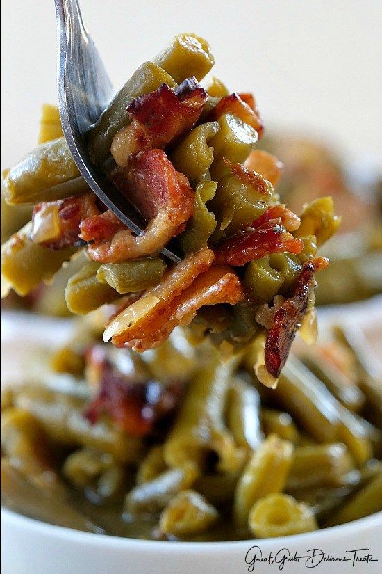 a spoon full of green beans and bacon