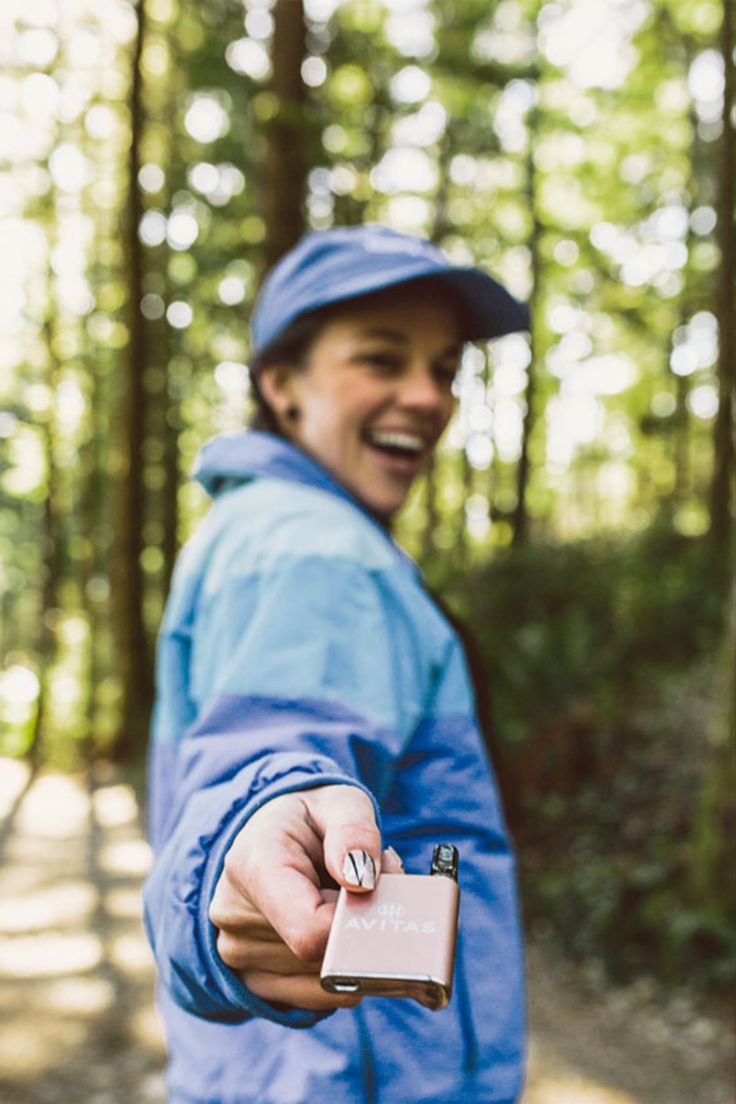 a person in the woods pointing at something