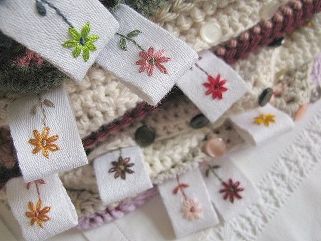 several pieces of fabric with flowers and leaves on them