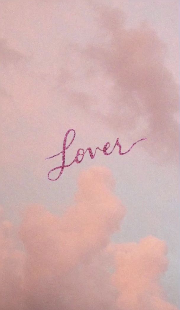 the word lover written in pink on a cloudy sky