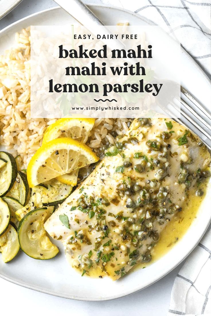 baked mahi with lemon parsley on a plate next to rice and zucchini