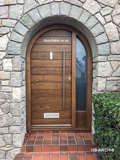 the front door is made to look like it has an arched glass and wood frame