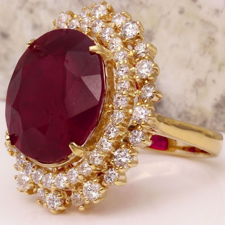 19.26 Carats Impressive Red Ruby and Diamond 14K Yellow Gold Ring Suggested Replacement Value $8,400.00 Total Red Ruby Weight is: 17.36 Carats (glass filled) Ruby Measures: 15.74 x 13.96mm Natural Round Diamonds Weight: 1.90 Carats (color G / Clarity VS2-SI1) Ring total weight: 11.6 grams Disclaimer: all weights, measurements and colors are approximate and may vary slightly from the listed dimensions or as seen in the image. All pictures are magnified to show the smallest of details. Please, ref Ruby Jewelry Ring, Ruby Ring Designs, Gold Jewelry Outfits, Emerald Wedding Rings, Etsy Gold Ring, Royal Jewels, Silver Jewelry Fashion, Ruby Jewelry, Pretty Rings