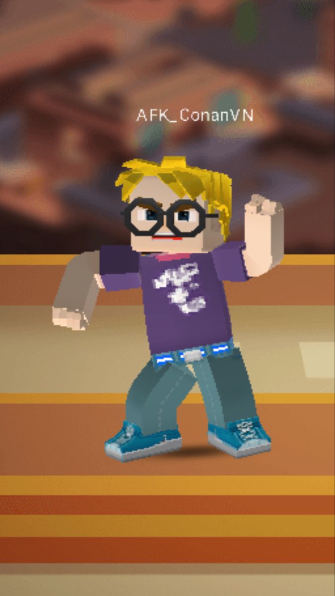 an image of a boy with glasses and a purple shirt holding his arms up in the air