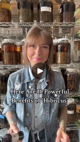 a woman standing in front of a shelf full of jars and spices with the words here are 10 powerful benefits of hibiscus