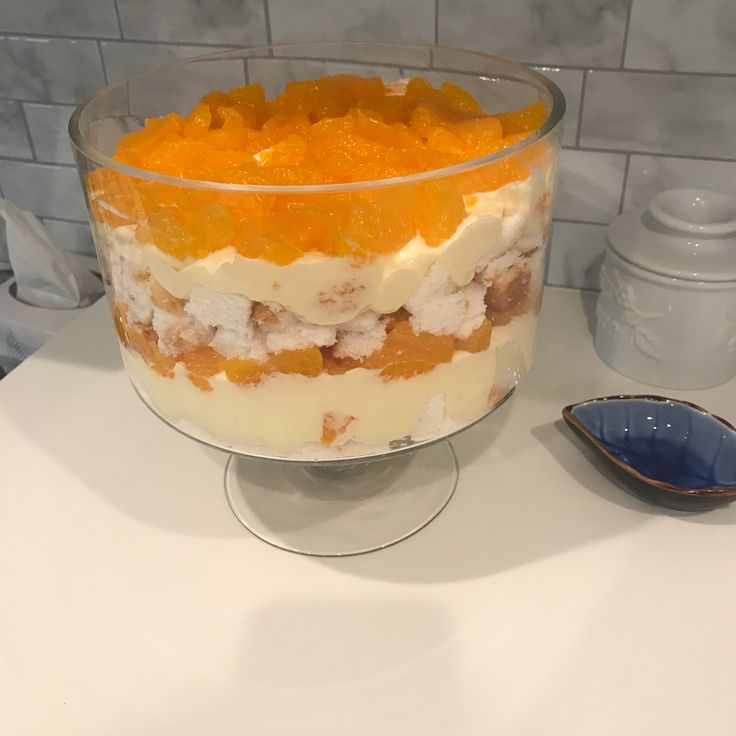 a glass dish filled with food sitting on top of a counter