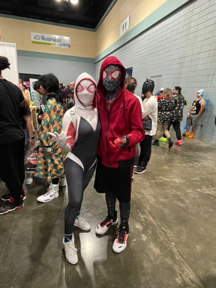 two people in costumes standing next to each other