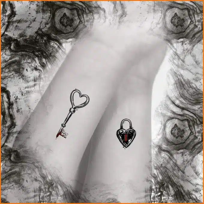 a couple of tattoos that are on someone's left arm with a key in the shape of a heart