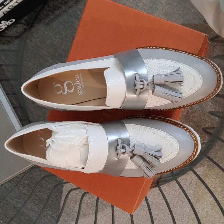 Loafer Made In Spain. New Condition Lug Sole. White And Silver Color. True To Size. White Round Toe Platform Loafers With Leather Sole, White Platform Loafers With Round Toe And Leather Sole, White Slip-on Platform Loafers With Flat Heel, Chic White Platform Loafers With Round Toe, White Tassel Loafers With Leather Sole And Round Toe, Elegant White Slip-on Tassel Loafers, Elegant White Tassel Loafers For Spring, White Round Toe Flats For Office, White Leather Tassel Loafers For Spring