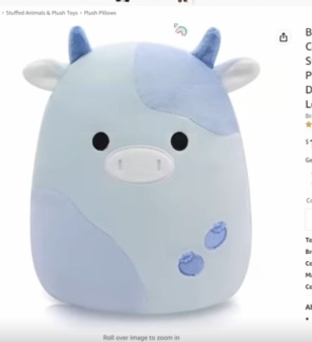 a blue and white stuffed animal sitting on top of a website page with other items in the background