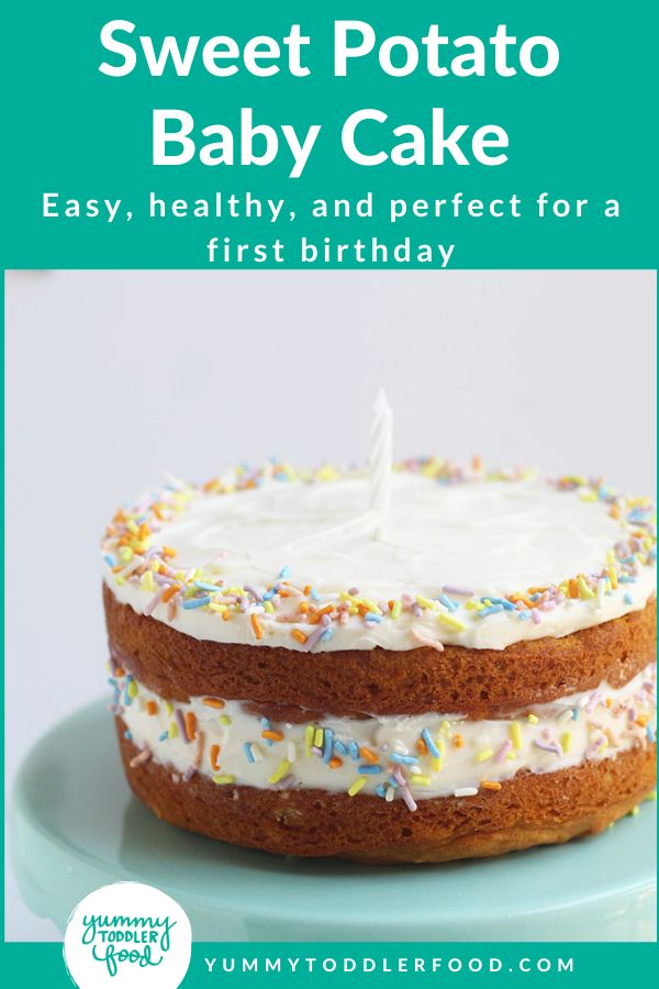 a cake with white frosting and sprinkles on top, sitting on a plate