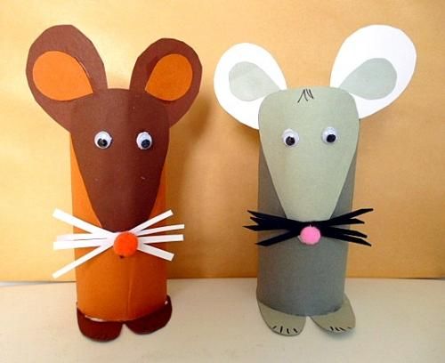 two paper mice are standing next to each other