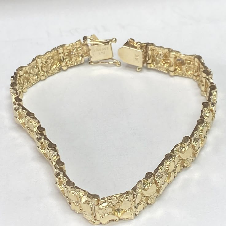 Estate 14k Yellow Gold Nugget Bracelet! Excellent Pre-owned Condition!!! Recently professionally polished, bracelet shows no visible signs of wear. Weight: 27.1g Length: 8” over all Gauge: 9.5mm wide Hallmarked: 14k All items are preowned and might show appropriate signs of age or wear. Item you see in the pictures is the actual item you are getting. lease look at the pictures carefully and use your own judgment before bidding Feel free to Ask any additional questions ALL SALES ARE FINAL NO RETURNS INSURED DOMESTIC SHIPPING ONLY Shipped with USPS First Class Package. Gold Nugget Jewelry, Custom Gold Jewelry, Xoxo Jewelry, Dope Jewelry Accessories, Nugget Bracelet, Dessert Cookbooks, Solid Gold Bracelet, Gold Teeth, Pretty Accessories