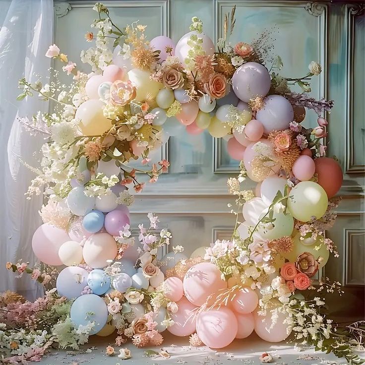 a wreath made out of balloons and flowers