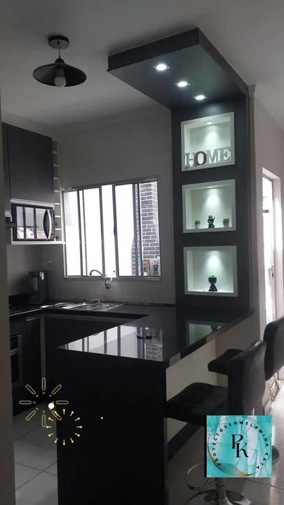 a modern kitchen with black and white decor