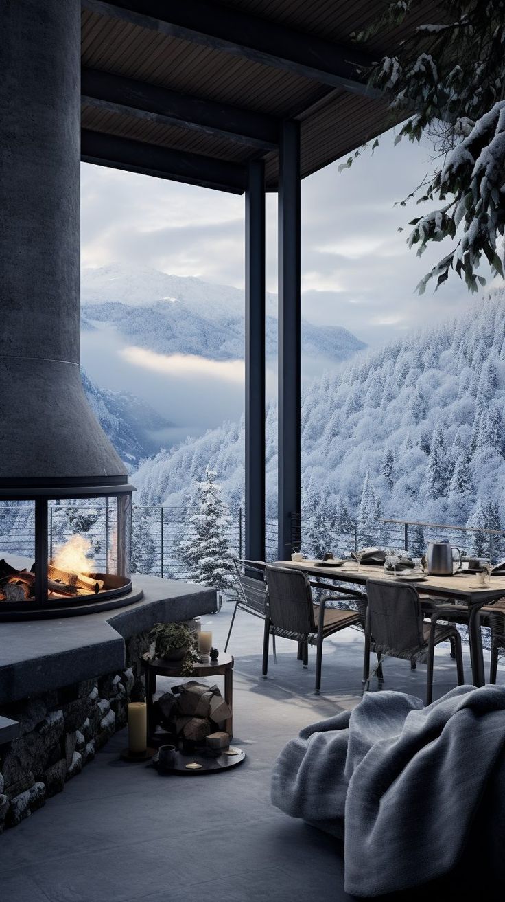 an outdoor dining area with a fireplace and mountain view