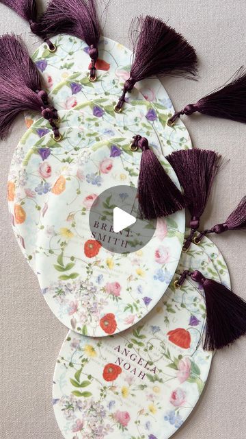 three paper plates with tassels on them