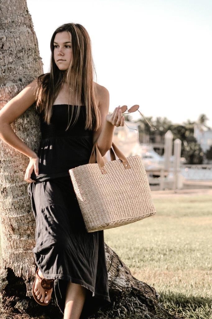 This airy, straw tote bag is finished with natural leather handles and a classic linen lining. Versatile and stylish, it's the perfect partner for airy dresses, summer prints or white denim. Content:- Straw- Leather - Linen Lining- Imported Size:- Width: 18.25" - Height: 12"- Depth: 6.59"- Handle Drop: 4.5" Chic Summer Bags Made Of Natural Fiber, Chic Beach Bag Made Of Natural Fiber, Chic White Straw Bag With Bamboo Handle, Bohemian Beach Bag With Leather Handles For Summer, Bohemian Summer Beach Bag With Leather Handles, Elegant Everyday Straw Bag With Bamboo Handle, Chic Natural Fiber Shoulder Bag With Bamboo Handle, Bohemian Beach Bag With Leather Handles For Spring, Spring Bohemian Beach Bag With Leather Handles