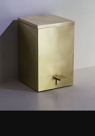 a gold box sitting on top of a white table