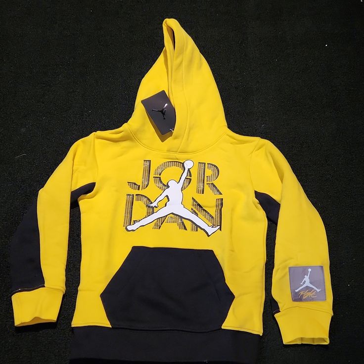 Brand New Jordan Hoodie For Boys, Size 5 Yellow Tops With Ribbed Cuffs For Streetwear, Casual Yellow Hoodie With Ribbed Cuffs, Yellow Long Sleeve Hoodie For Winter, Yellow Long Sleeve Hoodie, Yellow Hoodie With Kangaroo Pocket For Streetwear, Yellow Hoodie With Ribbed Cuffs For Streetwear, Yellow Winter Sweatshirt With Ribbed Cuffs, Yellow Fleece Hoodie For Winter, Yellow Sporty Sweatshirt For Fall