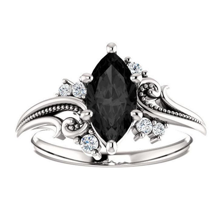 a black and white ring with diamonds on it