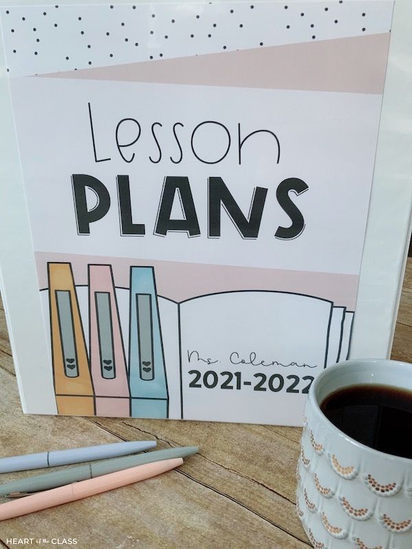 a lesson plan next to a cup of coffee on a wooden table with a pen and pencil