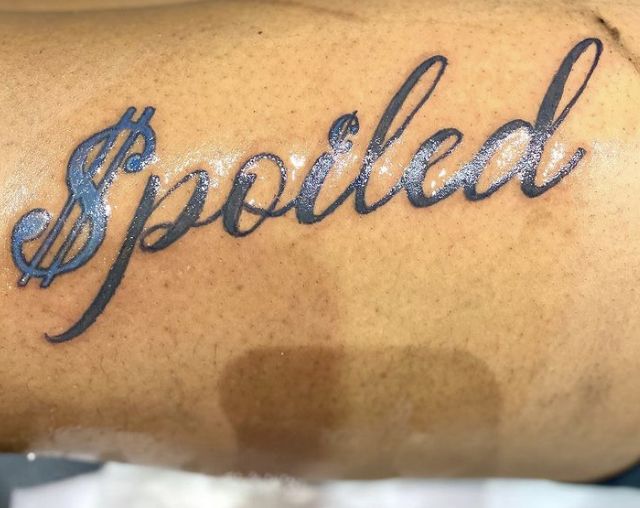 a tattoo with the word spoiled on it