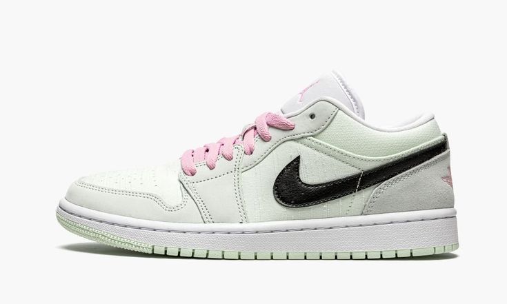 The Women’s Air Jordan 1 Low “Barely Green” is a women’s exclusive makeup of Michael Jordan’s first signature shoe that combines textures and colors in a unique way to tell its story.  One of the more unique Jordan 1 Low designs in the line, the “Barely Green” features mint green canvas on the perforated toe, mid-panel, and collar.  The same Barely Green hue appears on the leather forefoot and eyelets.  A slightly darker shade of green is used on the suede heel.  A black tumbled leather Swoosh b Womens Air Jordan 1, Womens Air Jordan, Green Jordans, Nike Sacai, Jordan Ones, Low Air Jordan 1, Jordan 8, Womens Air Jordans, Jordan Sneakers