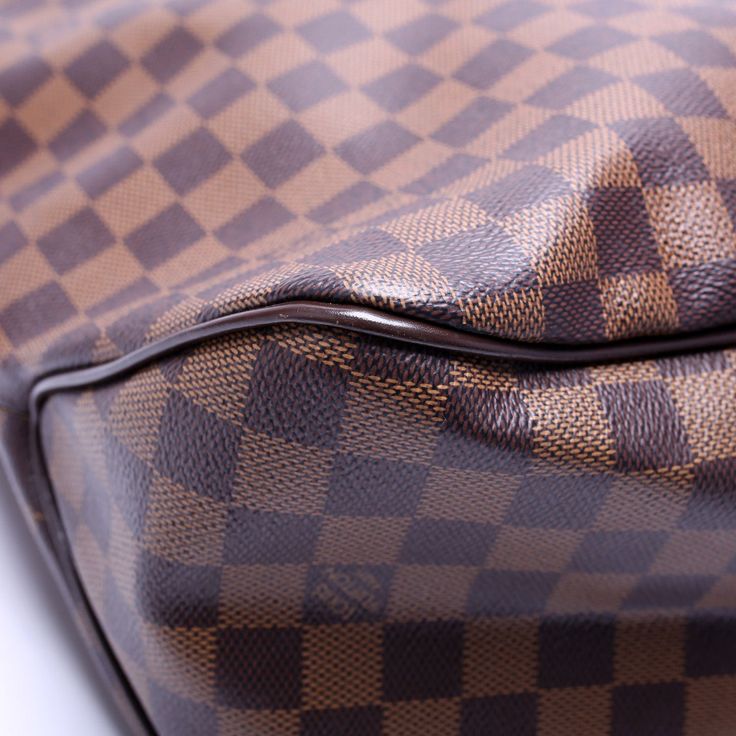 Louis Vuitton Delightful MM is. The exterior is in the classic Louis Vuitton Damier Ebene coated canvas. Condition: New Made in: 2015 (Date Code: SD2175) Color: Brown and Red Exterior: The exterior coated canvas is free of any rips or cracks. The corners and leather trim show light wear. Strap: The leather strap shows light wear. Hardware: The clasp closure operates properly. The hardware shows light wear. Interior: The interior has light stains and features one zip closure pocket. Dimensions: L: 18" / H: 12" / D: 5.5" Handle Drop: 7" Not Included: Original Dust Bag Louis Vuitton Siena, Louis Vuitton Delightful Mm, Louis Vuitton Neverfull Pm, Louis Vuitton Delightful, Louis Vuitton Neverfull Gm, Louis Vuitton Speedy 35, Neverfull Gm, Christian Dior Designer, Louis Vuitton Speedy 30