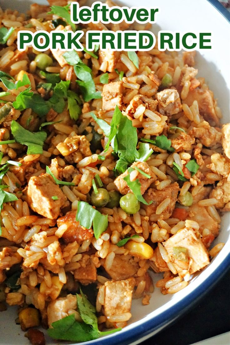 a bowl filled with rice and meat on top of a table