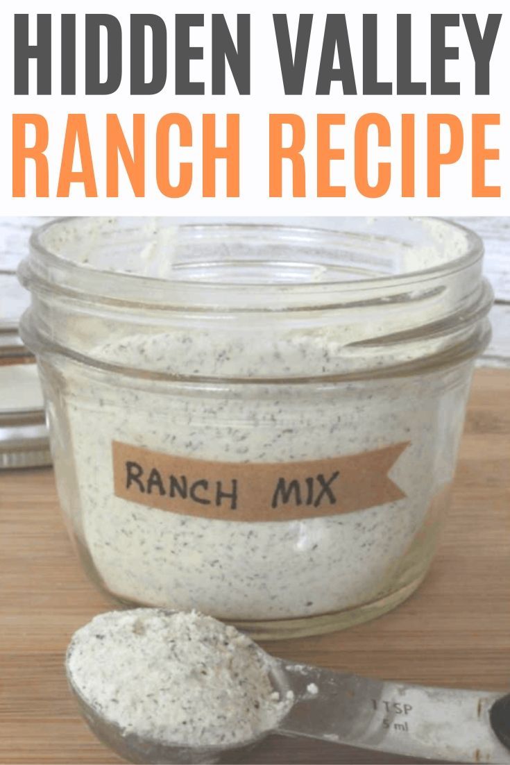 a jar filled with ranch mix next to a spoon