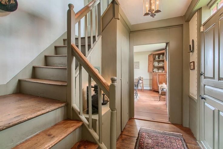 an entry way leading to a living room and dining room