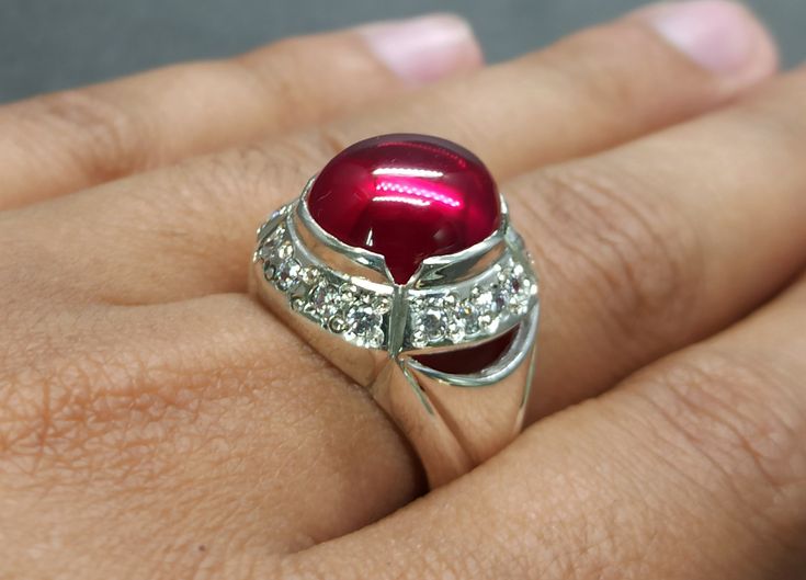 Cabochon Pigeon Dark Deep Red Ruby Sterling Silver 925 Handmade Women Ring Product: Ring Gemstone: Ruby Color: Red Handmade Ring It is heated and treated (lab created) but High Quality Ruby with pure 925 Sterling Silver Handmade Ring. Unique Cabochon Ruby Ring For Formal Occasions, Elegant Red Cabochon Gemstones, Classic Red Round Jewelry, White Gold Rings With Shiny Finish For Gift, White Gold Dome Ring With Polished Finish For Gift, Ruby Party Ring, Unique High Luster Round Jewelry, Red Gemstone Jewelry For Anniversary, Fine Jewelry White Gold Dome Ring As Gift