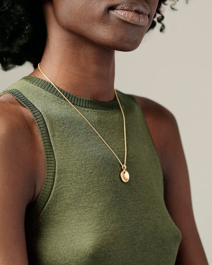 Description A gorgeous big sibling to our beloved Button Pendant, the Button Grand Pendant offers the same delight of pressing that soft center of buttery gold, but on a larger scale. Perfect to layer with different chain lengths and pendants. The finely crafted bail can accommodate our chains without the need of a jump ring, offering a more streamlined and solid feel. Solid gold to the core; never hollow. Its heft will thrill you. Explore the Button Collection. Details Solid 18k yellow gold (no Elegant Large Oval Medallion Necklace, Elegant Oval Medallion Necklace With Large Pendant, Elegant Polished Coin Pendant Necklace, Elegant Yellow Gold Medallion Necklace With Large Pendant, Elegant Round Pendant Coin Necklace With Polished Finish, Elegant Gold Round Disc Locket Necklace, Yellow Gold Medallion Pendant Necklace For Everyday, Elegant Pendant Locket Necklace For Everyday, Elegant Gold Medallion Necklace With Polished Finish