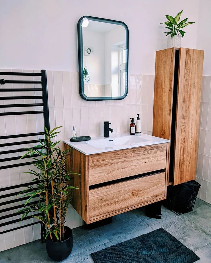 White bathroom with wood effect furniture and plants. Wood Effect Wall, Vanity Shelves, Inset Basin, Basin Vanity Unit, Wood Wall Hanging, Furniture Vanity, Wall Hung Vanity, Basin Taps, Wood Bathroom