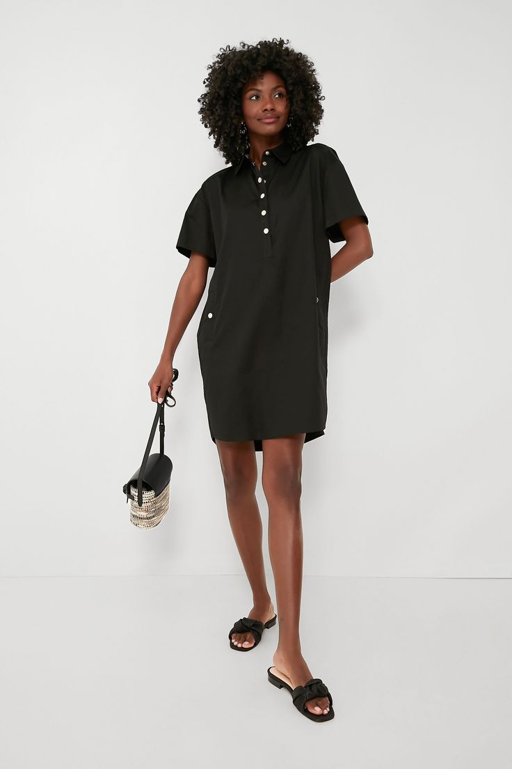 We tasked ourselves with giving the classic shirtdress a refresh, and this is the fabulous result. Keeping it simple yet elevated, the Black Oakley Dress is the definition of effortlessly chic. In a crisp cotton fabric that will drape perfectly and keep you feeling good no matter the weather, this mini features a sophisticated point collar, gold snaps down the partial placket and at the hip pockets, and a rounded hem. Wearable for nearly any occasion, this silhouette can do office days with loaf Black Collared Dress With Relaxed Fit, Black Relaxed Fit Collared Dress, Black Relaxed Fit Cotton Shirt Dress, Black Cotton Shirt Dress With Relaxed Fit, Black Cotton Relaxed Fit Shirt Dress, Black Relaxed Fit Shirt Dress For Work, Chic Black Shirt Dress With Relaxed Fit, Chic Black Relaxed Fit Shirt Dress, Casual Cotton Shirt Dress For Work