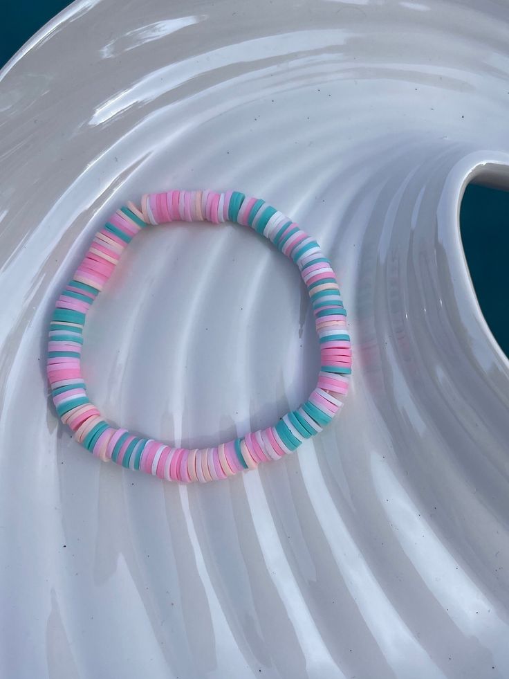 This bracelet is handmade and super stretchy so it should fit all wrist sizes! Hand-strung Bangle Stretch Bracelet For Beach, Trendy Flexible Bracelet For Beach, Multicolor Stretch Bracelet With Round Beads, Handmade Flexible Pink Bracelets, Casual Round Stretch Bracelet For Beach, Casual Beach Stretch Bracelet, Pink Hand-strung Bangle Stretch Bracelet, Casual Hand-strung Bangle Stretch Bracelet, Flexible Casual Beach Stretch Bracelet