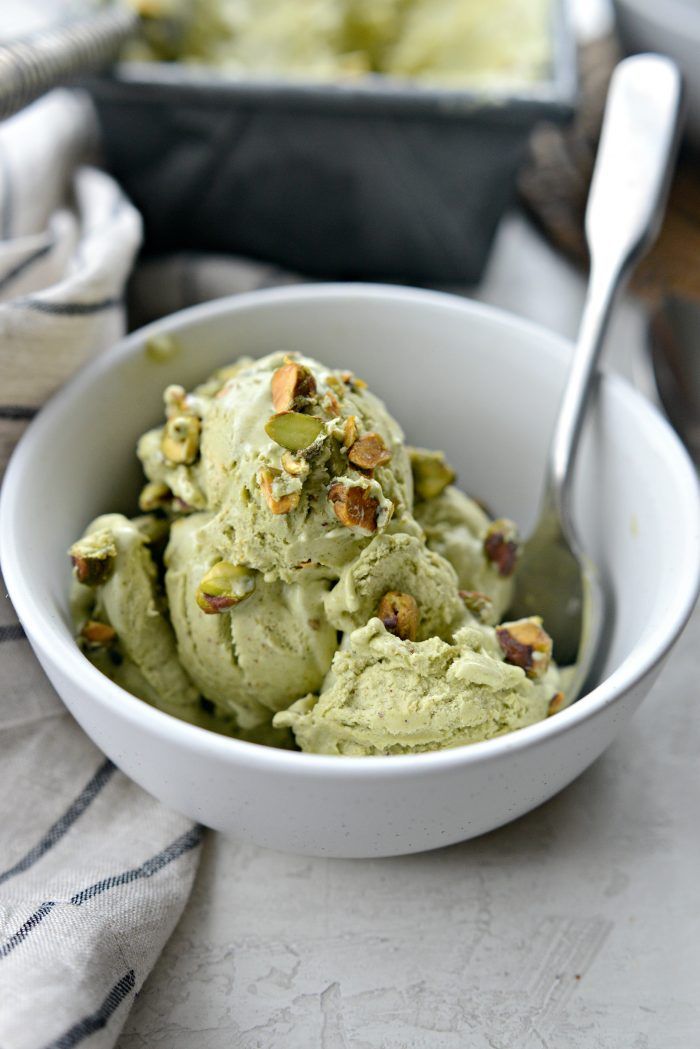 a white bowl filled with green ice cream