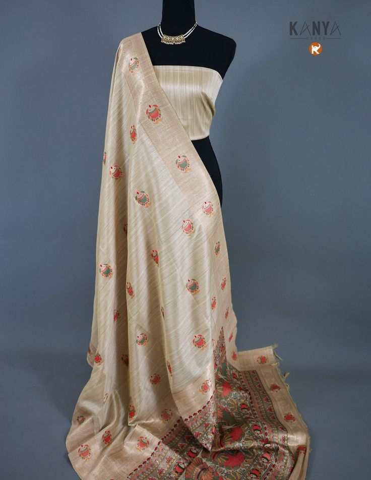 Elevate your sense of fashion with our Tussar saree! Made of premium quality Tussar fabric, this saree showcases unparalleled grace and elegance. Its lightweight and breathable nature make it perfect for any occasion. Experience the luxurious comfort and style with Tussar saree! Wedding Beige Dupatta In Slub Silk, Wedding Beige Slub Silk Dupatta, Festive Beige Saree For Designer Wear, Unstitched Beige Saree With Zari Work, Semi-stitched Beige Saree In Traditional Drape, Beige Semi-stitched Saree In Traditional Drape, Beige Tussar Silk Saree For Wedding, Unstitched Beige Saree For Festive Occasions, Elegant Beige Saree With Unstitched Blouse