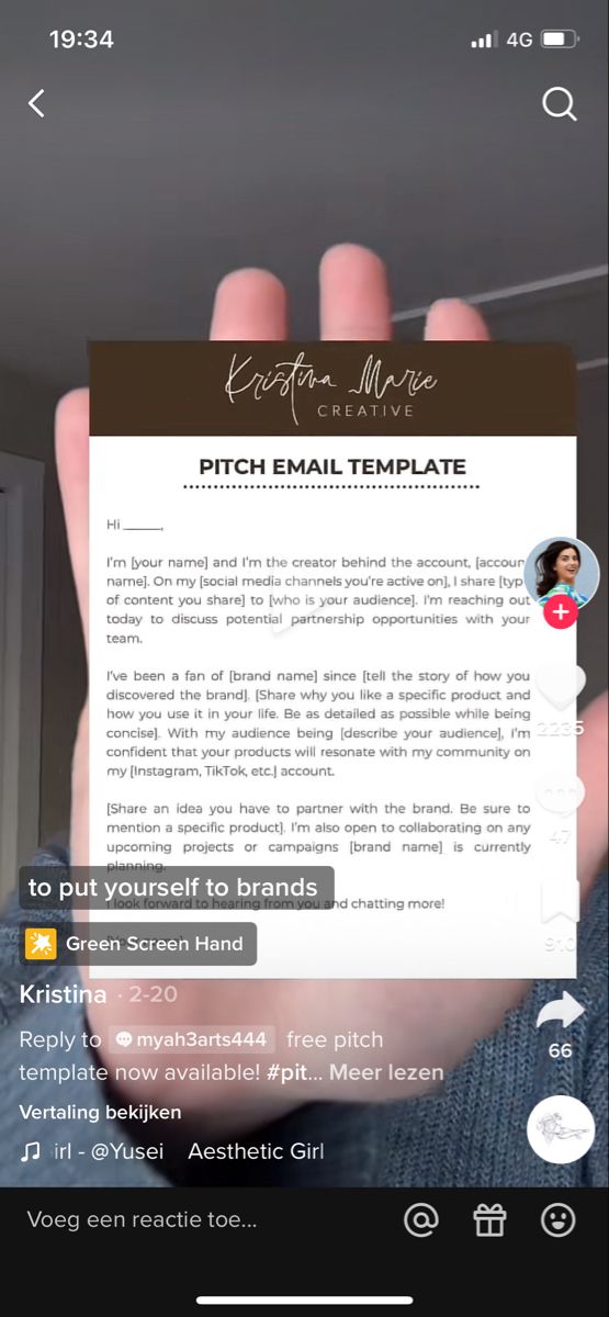 a person holding up a piece of paper that says pitch email template on the screen